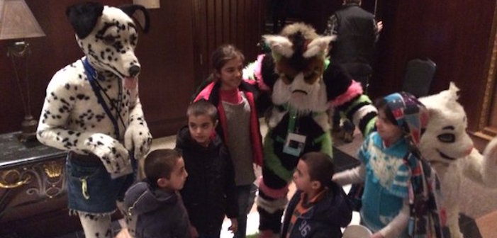 AWWWW! Furry Conference-Goers Comfort Syrian Child Refugees