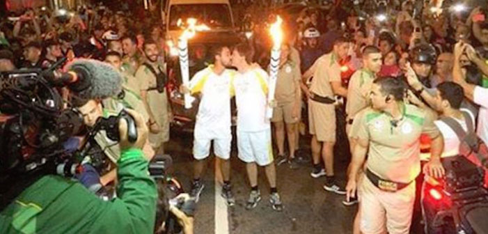 Flame On! Male Olympic Torchbearers Make Historic Kiss