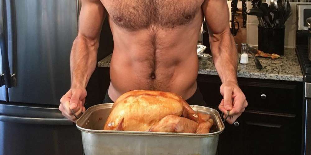 Celebrate Thanksgiving With Our Favorite Scruffy, Shirtless Hunk Holding a Turkey