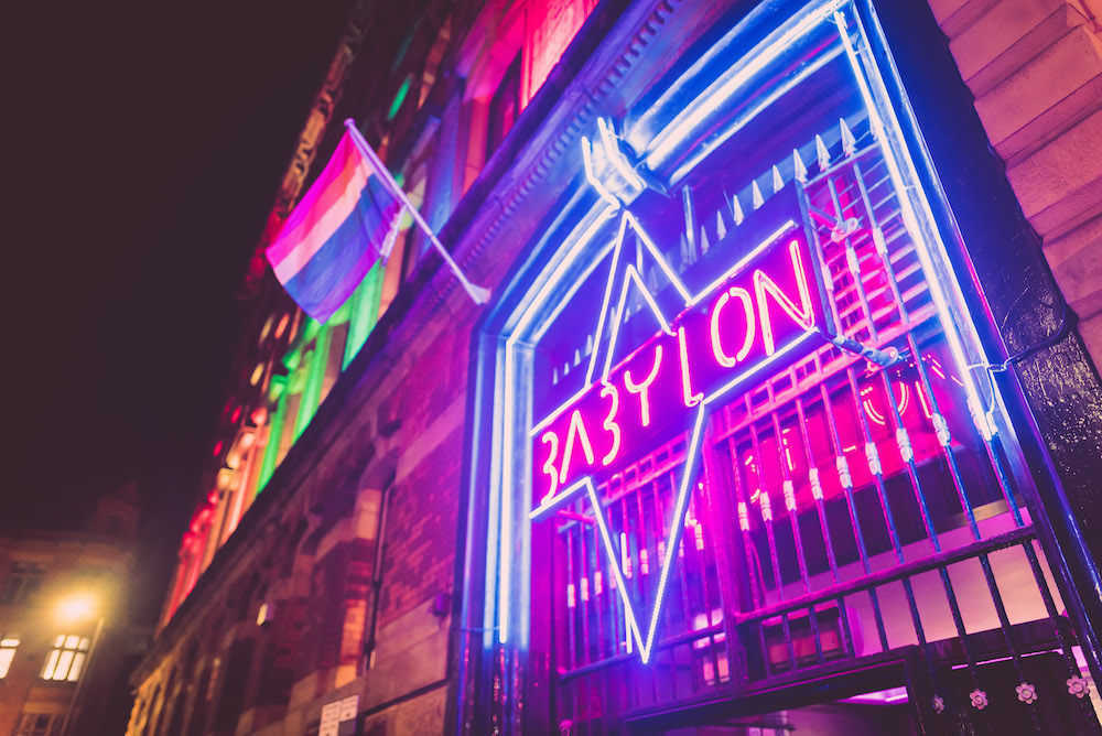 babylon party crowd sign